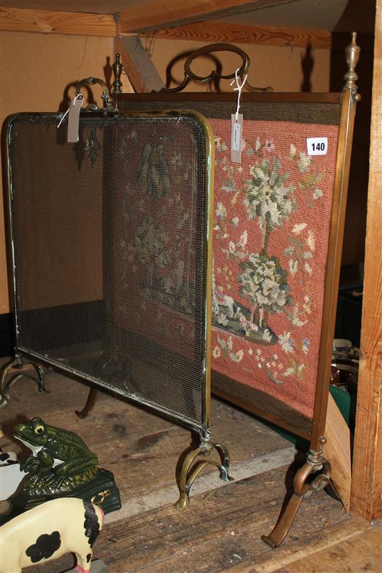 Two fire screens, one with needlework panel